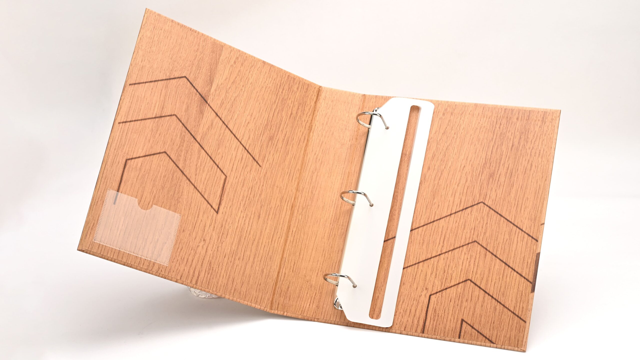 Interior business card pocket with plastic document holder strip
